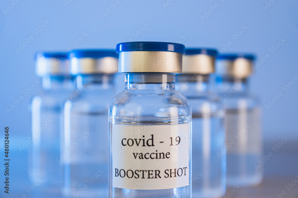 COVID-19 booster vaccine vials. Medicine and health care concept