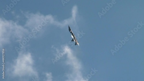 Fifth generation aircraft airplane of Su-57 in flight performs a complex aerobatics. Plane flies forward bottom of fuselage. Close-up. Zhukovsky, Russia, August 27, 2013
