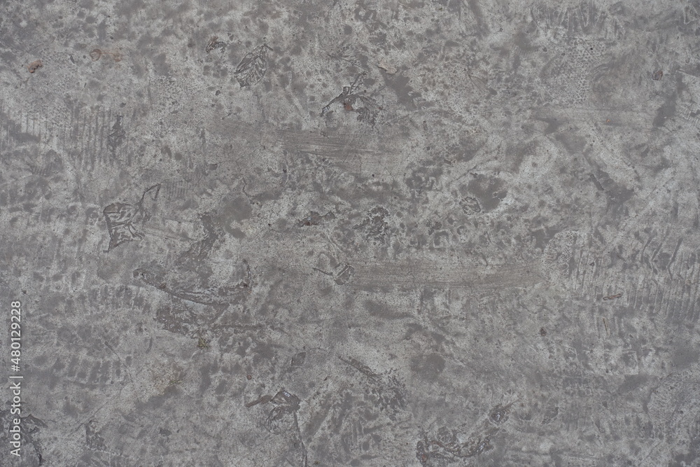 Naklejka premium dirty and scratched gray concrete slab from above