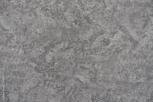 dirty and scratched gray concrete slab from above