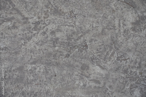 scratched and dirty gray concrete slab from above