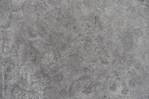 Surface of dirty and scratched gray concrete slab from above