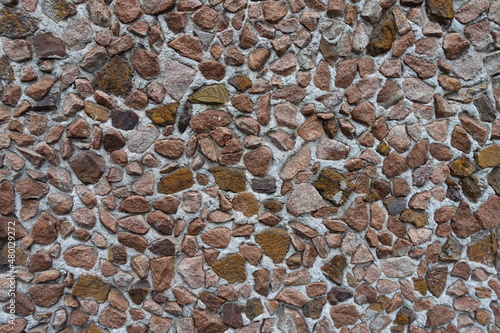 Texture of wall with multicolored gravel pebble dash