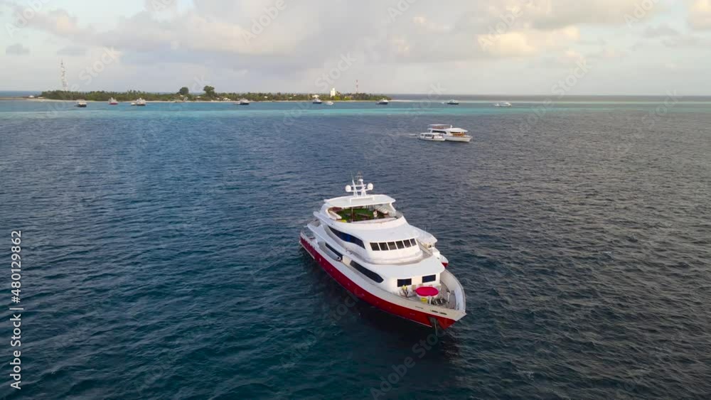 Sailing on a yacht near the islands of the Maldives archipelago. Sailing on a yacht near the islands of the Maldives archipelago.