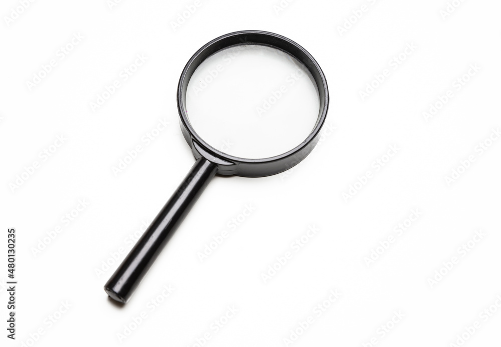 Magnifying glass. Magnify tool isolated, white background. Loupe with black metal frame and handle Magnifying glass. Magnify tool isolated, white background. Loupe with black metal frame and handle