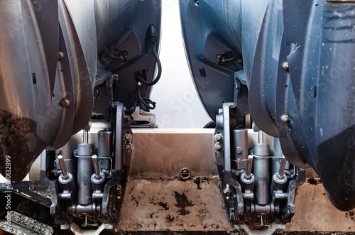 Lifting mechanisms on outboard motors at the stern of the boat. Transom lift on outboard motors of a motor boat.