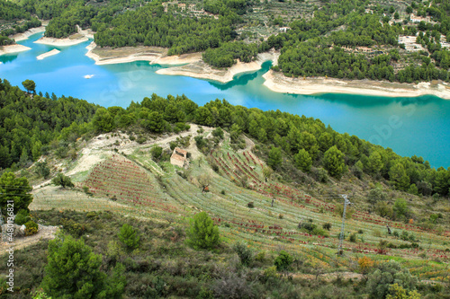 The swamp of Guadalest village surrounded by vegetation and mountains photo