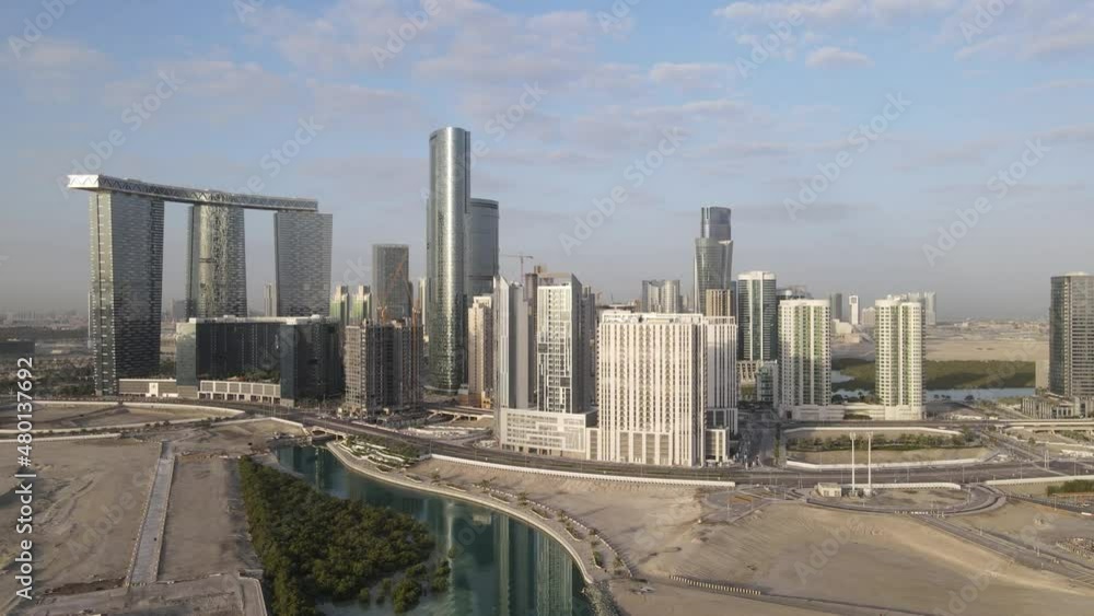 Aerial view on developing part of Al Reem island in Abu Dhabi on a cloudy morning. Drone footage. Aerial view on developing part of Al Reem island in Abu Dhabi on a cloudy morning. Drone footage.