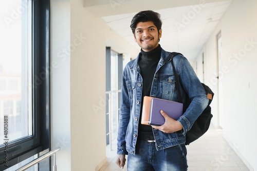 Happy indian male student at the university photo