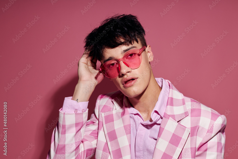 Obraz premium Photo of romantic young boyfriend in pink glasses pink blazer posing studio pink background unaltered