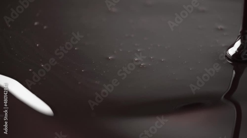 Chocolate flows in a thin stream.