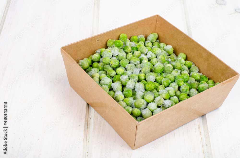 Frozen green peas, preservation of vitamins and vegetables. Studio Photo Frozen green peas, preservation of vitamins and vegetables. Studio Photo