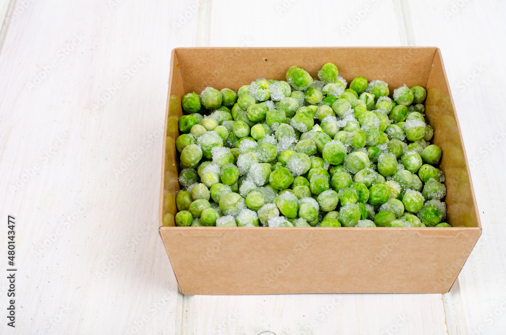 Frozen green peas, preservation of vitamins and vegetables. Studio Photo Frozen green peas, preservation of vitamins and vegetables. Studio Photo