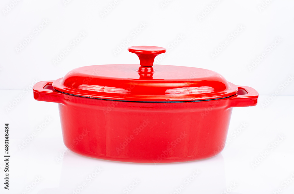Red ceramic cast iron casserole dish. Studio Photo Red ceramic cast iron casserole dish. Studio Photo