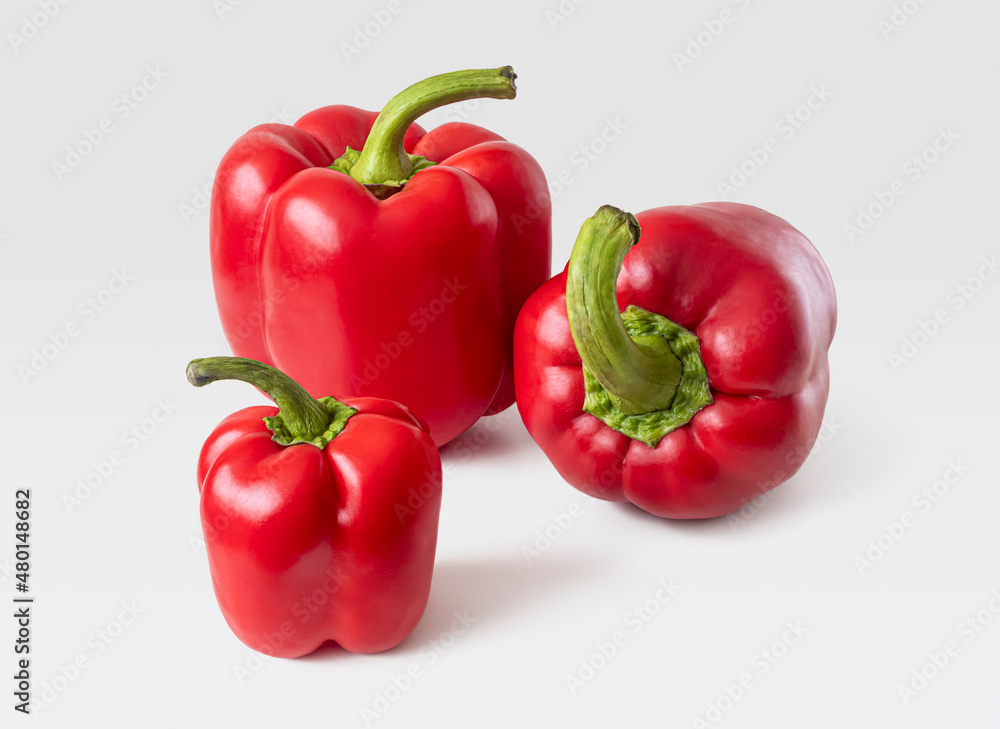 Bright red bell peppers with thick green cuttings Bright red bell peppers with thick green cuttings