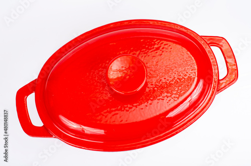 Red ceramic cast iron casserole dish. Studio Photo photo