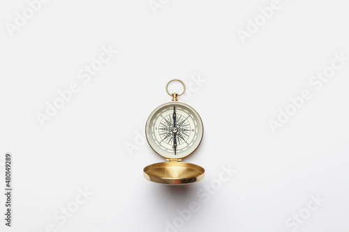 Golden compass on white background concept - direction, top view