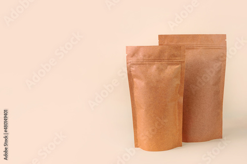 Pouch bags mockup neutral beige background monochrome. Merchandise packaging Blank brown kraft paper pack coffee beans product template copy space Tea food snack delivery Shop store sale demonstration