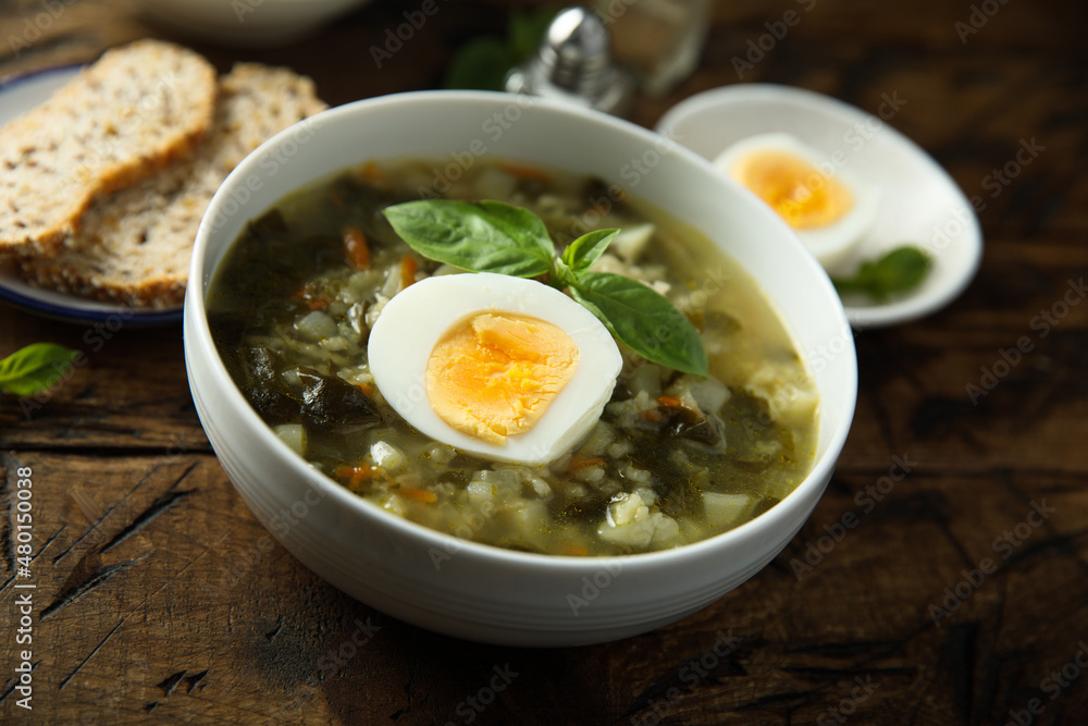 Traditional homemade green soup with hard boiled eggs Traditional homemade green soup with hard boiled eggs