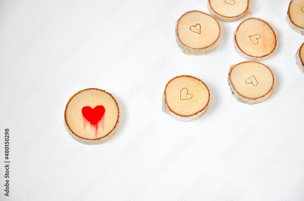 Pine tree slice with red blood heart symbol on white background. Valentines day wallpaper Pine tree slice with red blood heart symbol on white background. Valentines day wallpaper