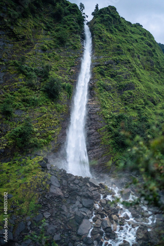 Scenic Birthi water fall with tourists at Munsiyari Uttarakhand India.