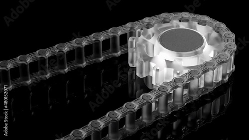 Bicycle chain is attached to the sprocket or gear. Made of translucent plastic. Spinning on black background. Animation seamless loop, 3D Render. photo