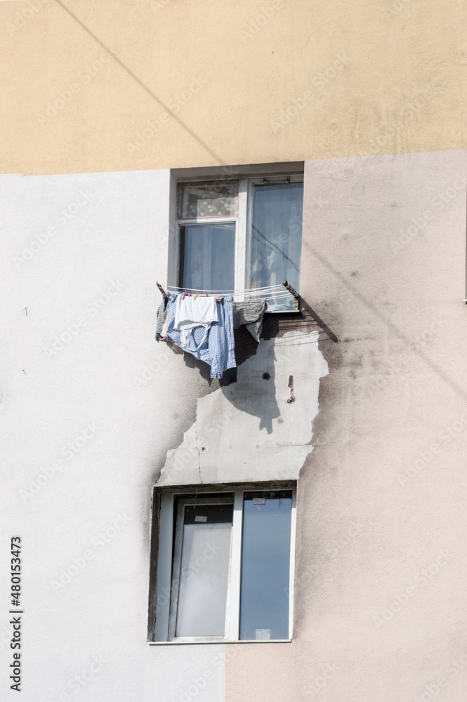 Sooty wall and windows of house after fire