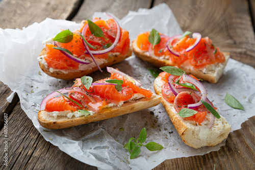 Sandwich with smoked salmon and cream cheese on a crispy baguette