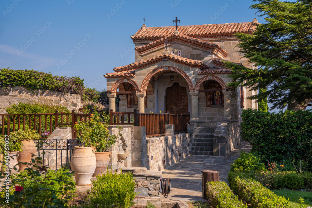 Beautiful scenic view of courtyard in Orthodox Monastery of Áyios Stéfanos (St. Stephen), hanging on cliff and rock formations of Meteora mountain, Kalabaka Greece.