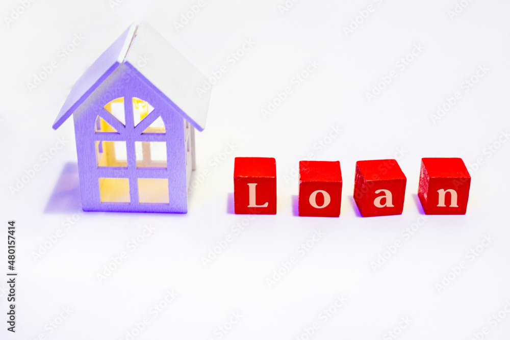 Financial loan and commercial real estate, real estate and investment concepts with a model house with luminous windows inside. Financial loan and commercial real estate, real estate and investment concepts with a model house with luminous windows inside.