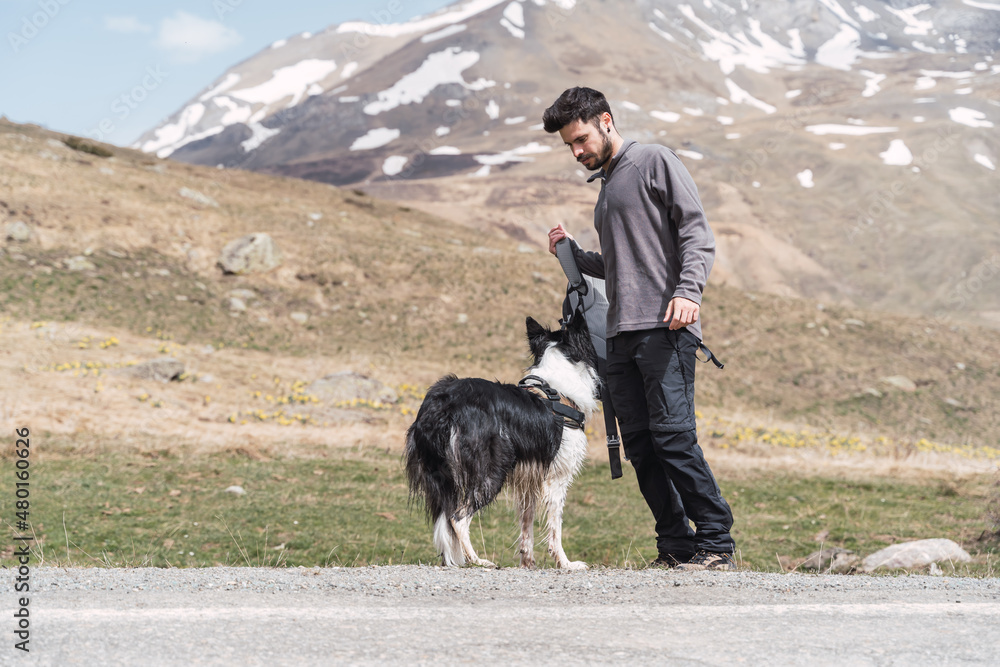 Man and his dog in the mountain