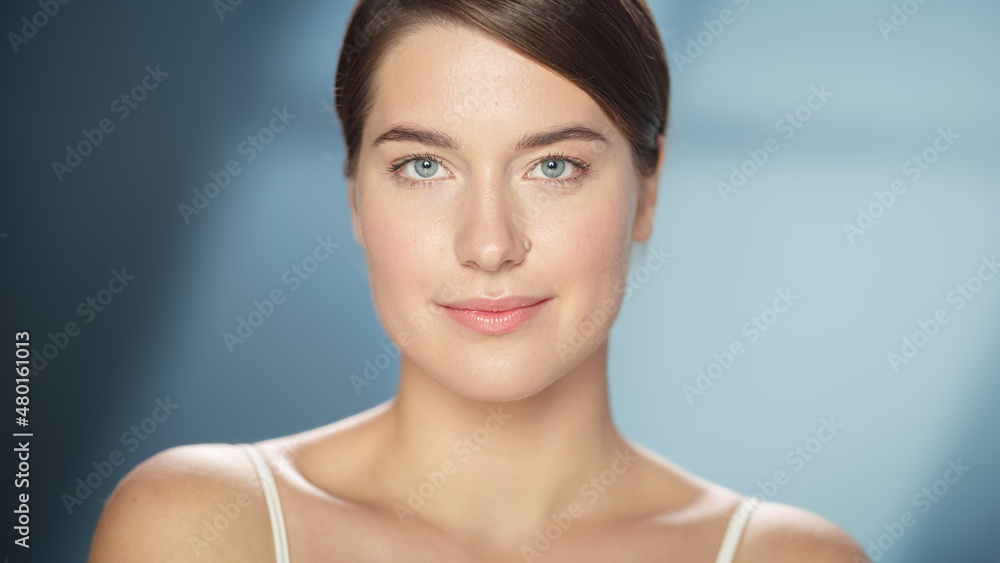 Female Beauty Portrait. Happy Caucasian Woman with Brown Hair and Light Green Eyes Posing, Touching Her Natural, Healthy Skin. Wellness and Skincare Concept on Soft Isolated Background. Close Up. Female Beauty Portrait. Happy Caucasian Woman with Brown Hair and Light Green Eyes Posing, Touching Her Natural, Healthy Skin. Wellness and Skincare Concept on Soft Isolated Background. Close Up.