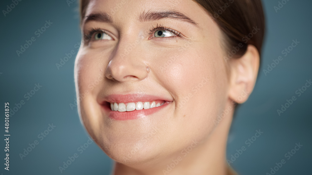 Close Up Female Beauty Portrait. Happy Caucasian Woman with Natural Healthy Skin, Brown Hair and Light Green Eyes Posing and Smiling. Wellness and Skincare Concept on Soft Isolated Background. Close Up Female Beauty Portrait. Happy Caucasian Woman with Natural Healthy Skin, Brown Hair and Light Green Eyes Posing and Smiling. Wellness and Skincare Concept on Soft Isolated Background.