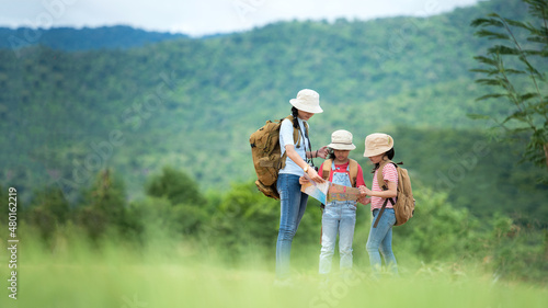 Group family children travel on car for adventure nature in vacations. Asia people tourism checking map for explore natural destination and leisure trips travel for education. Travel Concept