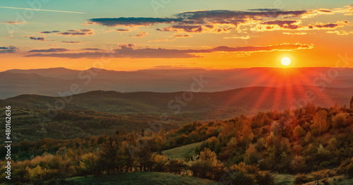 Spring Sunset over green mountains 