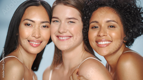 Beauty Portrait of Three Diverse Multiethnic Models on Isolated Background. Fun Joyful Asian, Black and Caucasian Women with Natural, Healthy Skin. Wellness, Spa, Cosmetology, Skincare Concept.
