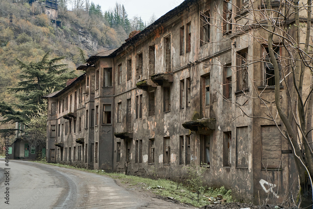 Abandoned crumbling buildings in a residential city. A dying city. Frightening atmosphere