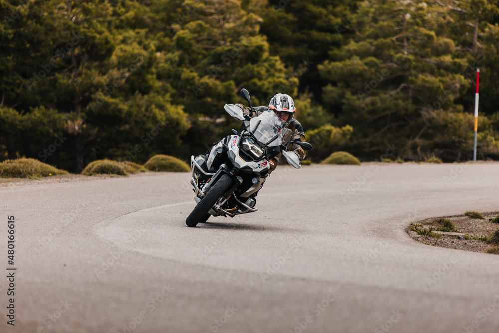 Sierra de los Filabres, Spain - May 5th 2021: Motorbike rider riding BMW R  1250 GS motorcycle