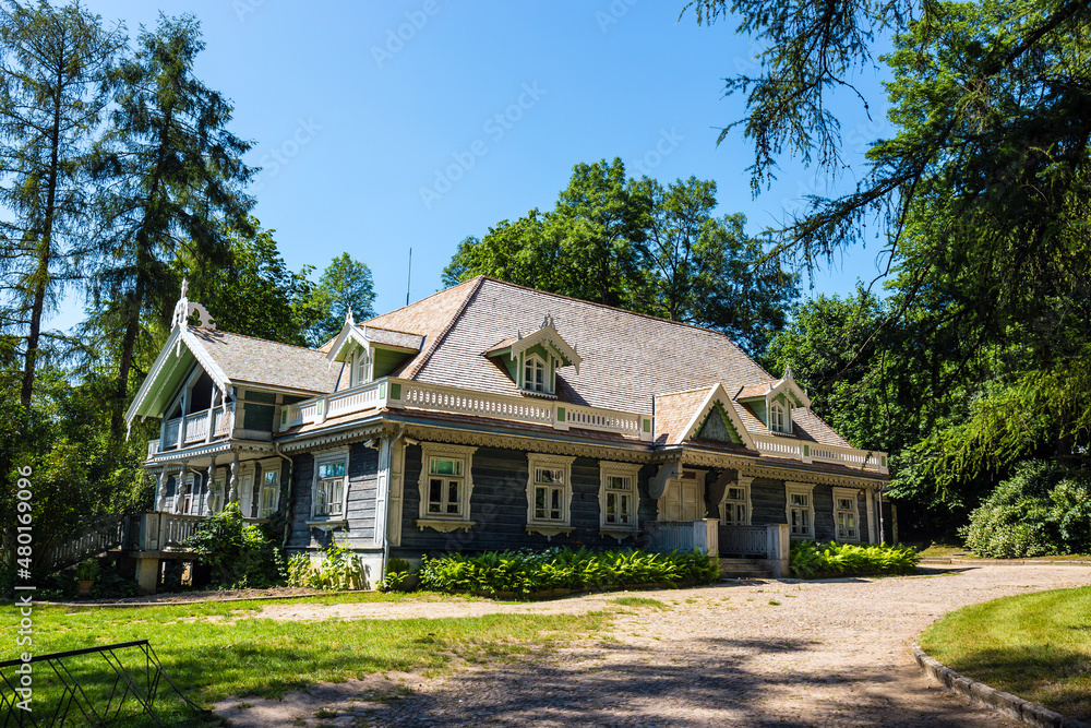 Old wooden, historic hunters manor house. Bialowieza Palace Park, Poland Old wooden, historic hunters manor house. Bialowieza Palace Park, Poland