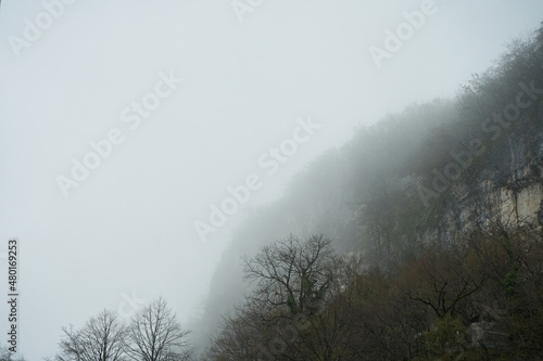 View of the high-mountain valley  heavy fog. Limited visibility