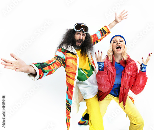 Ski sport concept. Funny young couple on white background.