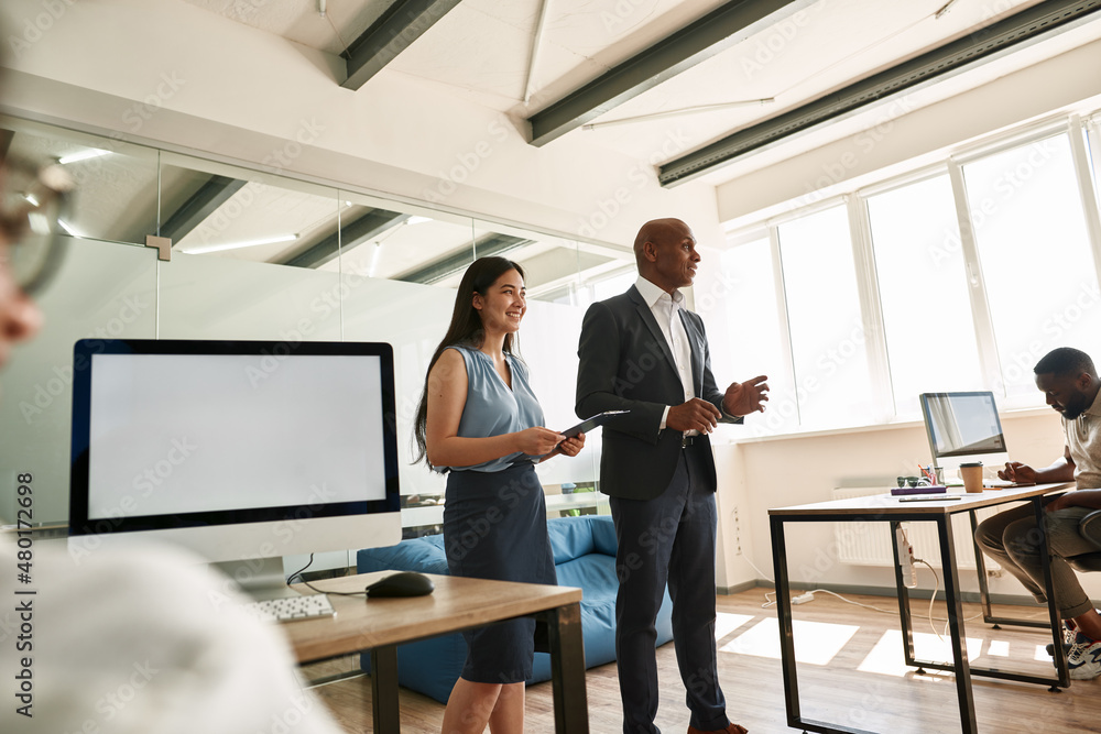 Black boss telling company strategy to employees Black boss telling company strategy to employees