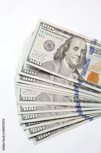 100 dollar US banknotes placed on a white background.