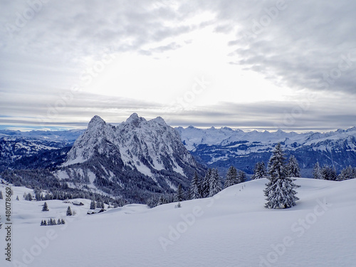 Beautiful winter landscape in the Swiss mountains. Panoramic view over the snow covered landscape.