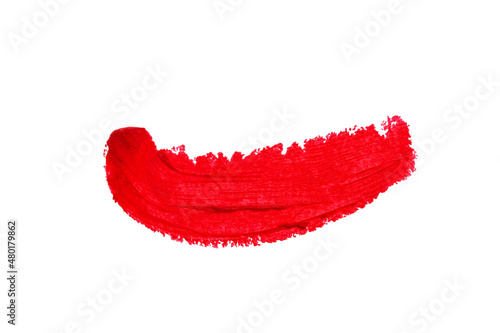 Smear for lipstick in bright red color isolated on white background.