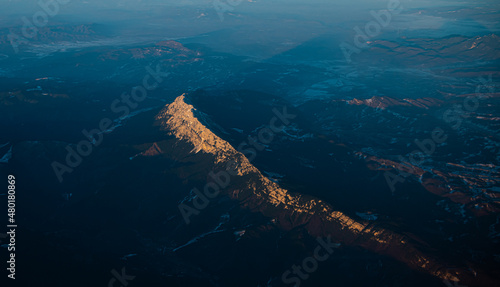 Mountains of Romania. Aerial view of Piatra Craiului National Park in sunset light. Amazing landscape from Transylvania.