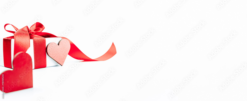 Valentine greeting card. Red heart, romantic gift with red ribbon on love white background. Valentines day decoration card with copy space. Valentine greeting card. Red heart, romantic gift with red ribbon on love white background. Valentines day decoration card with copy space.
