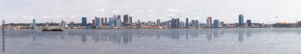 Full panoramic view at the Luanda city downtown, Modern skyscrapers buildings, bay, Port of Luanda, marginal and central buildings, building reflection on bay water, Angola Full panoramic view at the Luanda city downtown, Modern skyscrapers buildings, bay, Port of Luanda, marginal and central buildings, building reflection on bay water, Angola