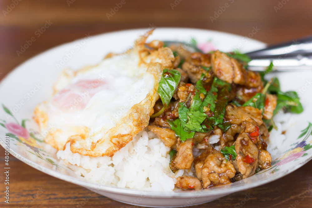 Rice topped with stir-fried pork and basil Rice topped with stir-fried pork and basil