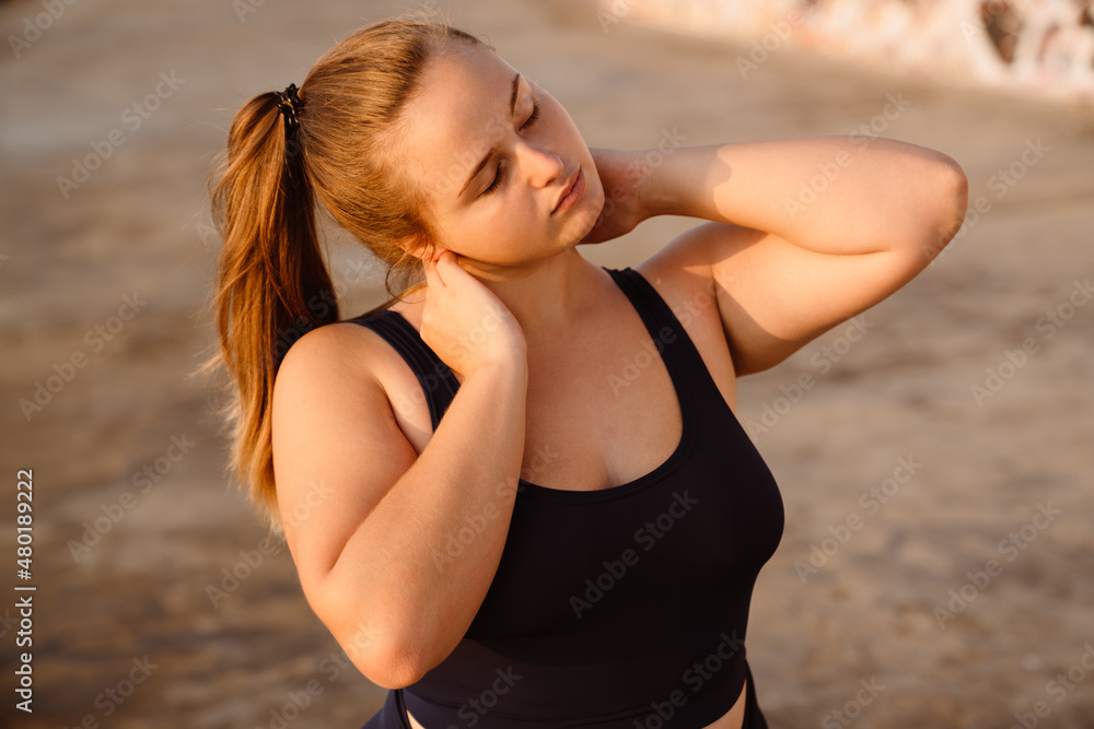 Young ginger woman doing exercise during yoga practice Young ginger woman doing exercise during yoga practice